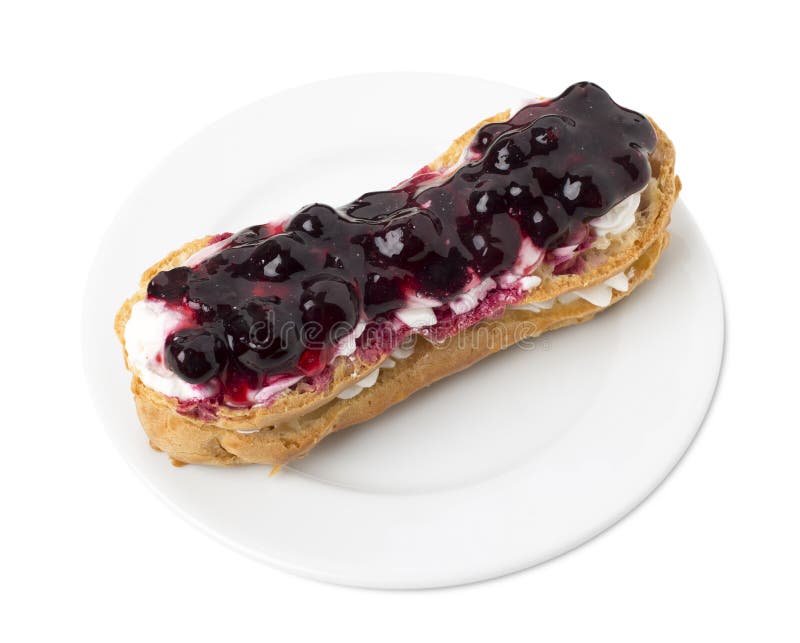 Eclair delicioso con el atasco de la baya fotos de archivo