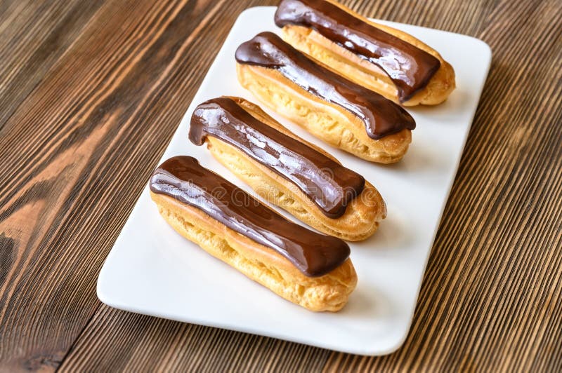 Eclairs with Chocolate Topping Stock Image Image of gold, restaurant