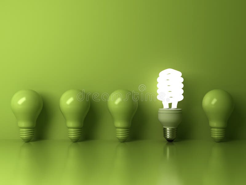 Eco energooszczędna żarówka, jeden rozjarzony ścisły fluorescencyjny lightbulb stoi out od unlit płonącego żarówki odbicia
