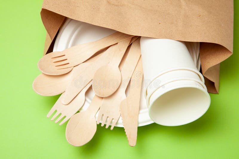 Ecofriendly Disposable Utensils Made of Bamboo Wood and Paper on a