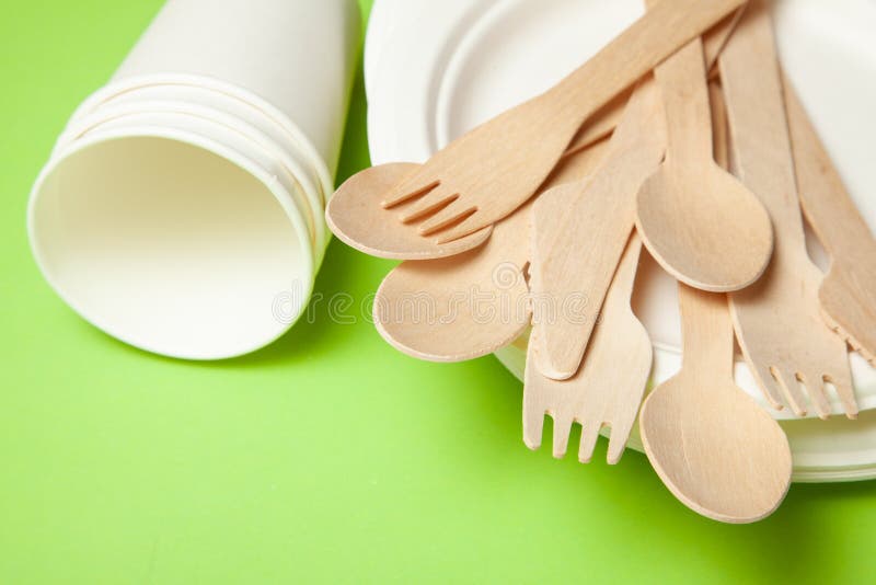 Ecofriendly Disposable Utensils Made of Bamboo Wood and Paper on a