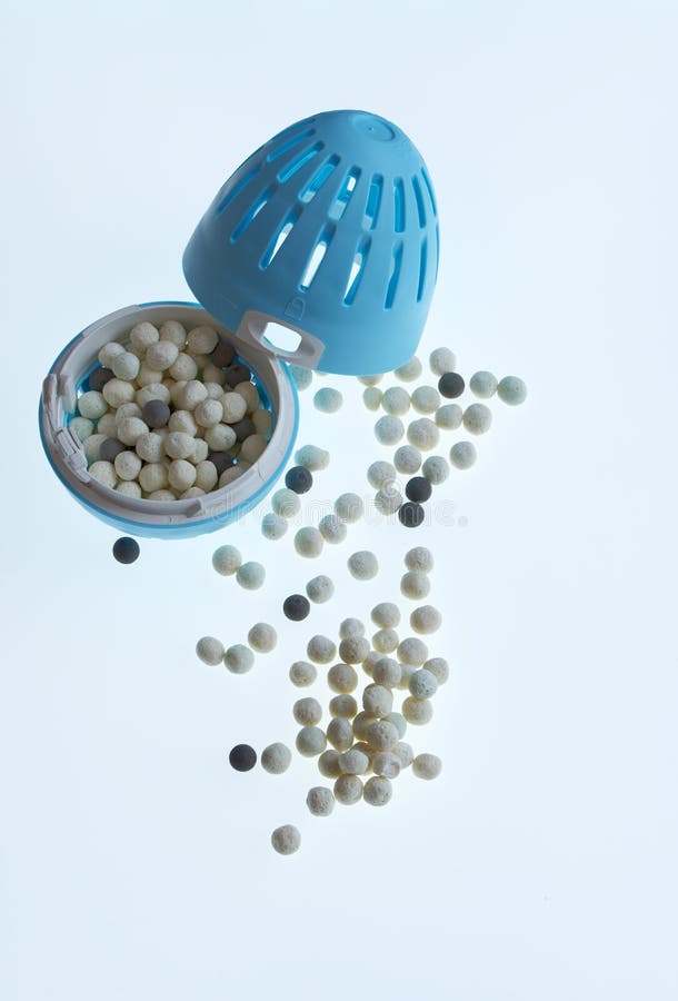 Eco Laundry Egg and Pellets on White Background. Stock Photo Image of
