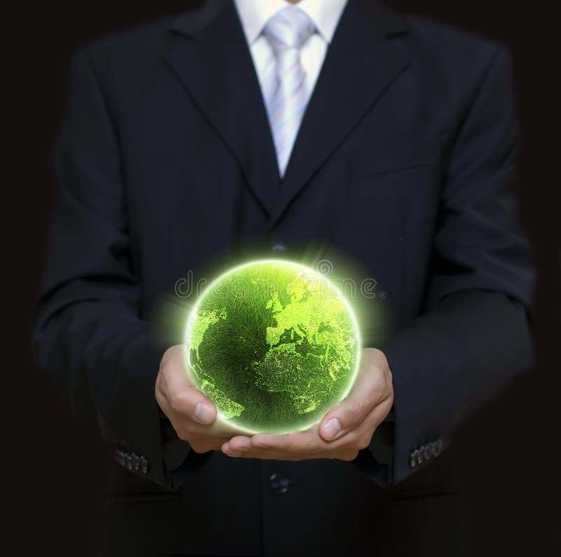 Businessman holding green planet in the night full of lights. Male hand holding businessman stock images, royalty-free photos and pictures