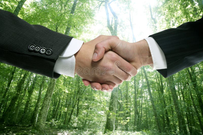 Ecological handshake businessman in a forest royalty free stock photography Ecological handshake businessman in a forest royalty free stock photography