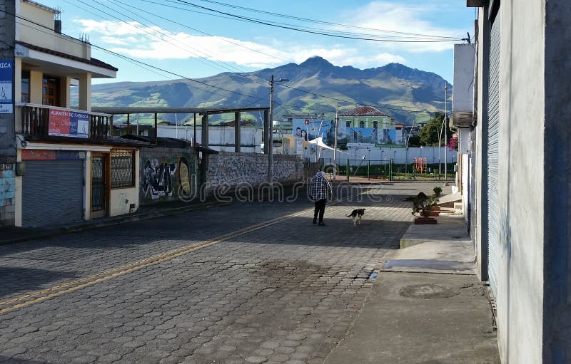 Calle de los Panzas.  Machcachi town. In the background are the Andes Mountains. Equador. June. 2018. Calle de los Panzas.  Machcachi town. In the background are the Andes Mountains. Equador. June. 2018.