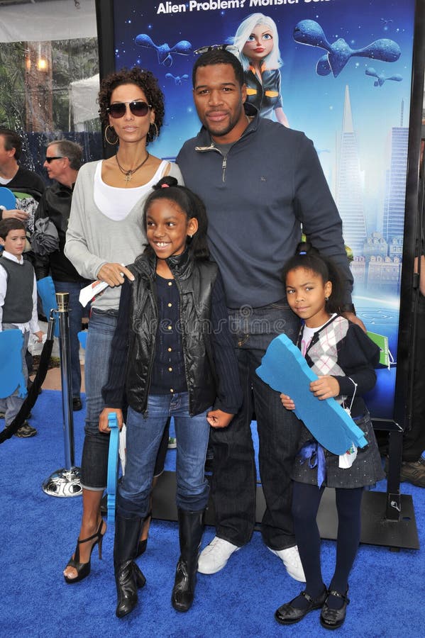 Eddie Murphy, Michael Strahan, Nicole Mitchell Murphy fotografie stock libere da diritti Eddie Murphy, Michael Strahan, Nicole Mitchell Murphy fotografie stock libere da diritti