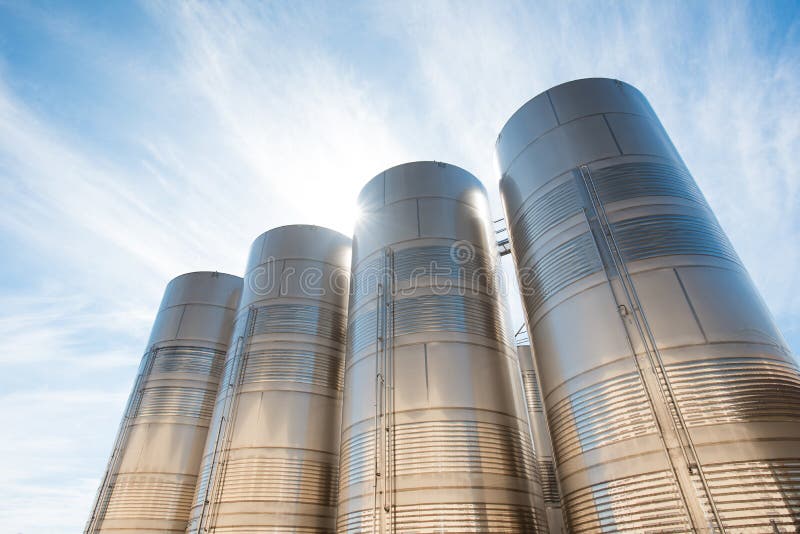 Stainless steel silos at high noon. Stainless steel silos at high noon