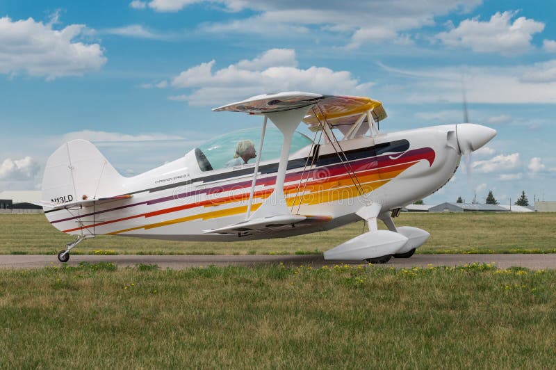 EDEN PRAIRIE, MN - JULY 16, 2016: Christian Eagle II piloted by Denny O’Connell on taxiway at air show. The Christian Eagle II is an aerobatic sporting biplane produced in the US since the late 1970s. EDEN PRAIRIE, MN - JULY 16, 2016: Christian Eagle II piloted by Denny O’Connell on taxiway at air show. The Christian Eagle II is an aerobatic sporting biplane produced in the US since the late 1970s.