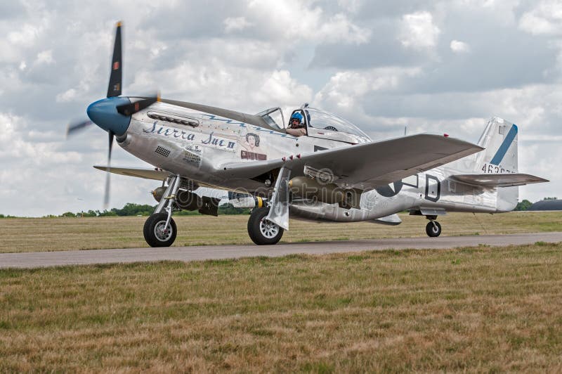EDEN PRAIRIE, MN - JULY 16, 2016: P-51 Mustang “Sierra Sue II” moves on taxiway at air show. The P-51 Mustang was a long-range, single-seat fighter used primarily during World War II. EDEN PRAIRIE, MN - JULY 16, 2016: P-51 Mustang “Sierra Sue II” moves on taxiway at air show. The P-51 Mustang was a long-range, single-seat fighter used primarily during World War II.