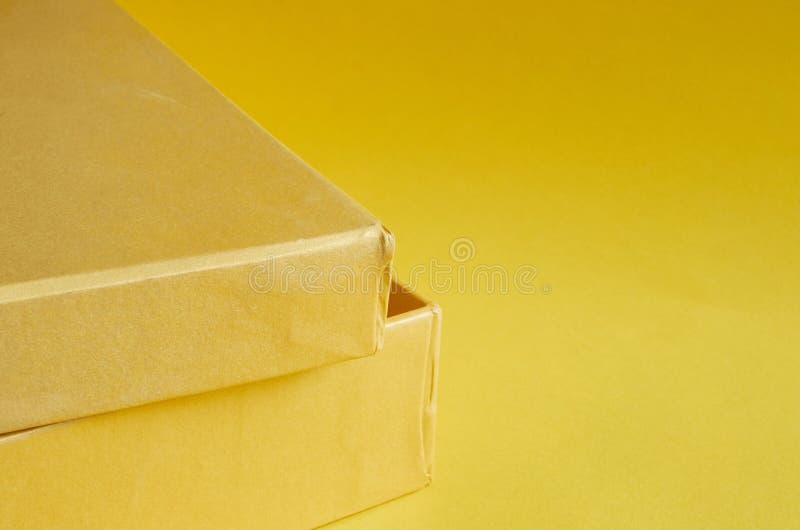 Edge of a Yellow Cardboard Box on Yellow Background Stock Photo Image of object, people 194722426