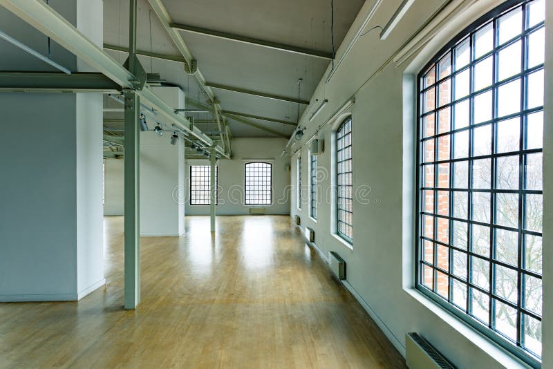 Building interior with loft windows and wood floor. Building interior with loft windows and wood floor