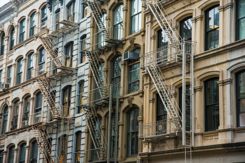 Office building with fire escapes in Soho district of New York City. Office building with fire escapes in Soho district of New York City