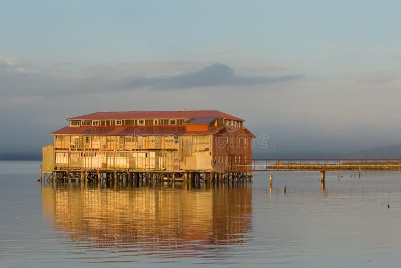 Photo of an old cannery building in Astoria, Oregon at sunset. Photo of an old cannery building in Astoria, Oregon at sunset