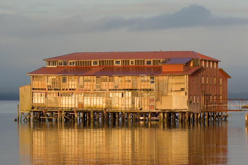 Photo of an old cannery building in Astoria, Oregon at sunset. Photo of an old cannery building in Astoria, Oregon at sunset