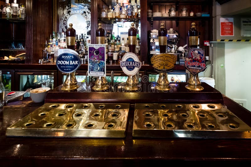 Edinburgh, Scotland - April 27, 2017 : Beer taps inside traditional english pub in Edinburgh, Scotland