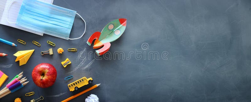 Education. Back to school concept. rocket cut from paper and painted over blackboard background. top view, flat lay royalty free stock image Education. Back to school concept. rocket cut from paper and painted over blackboard background. top view, flat lay royalty free stock image