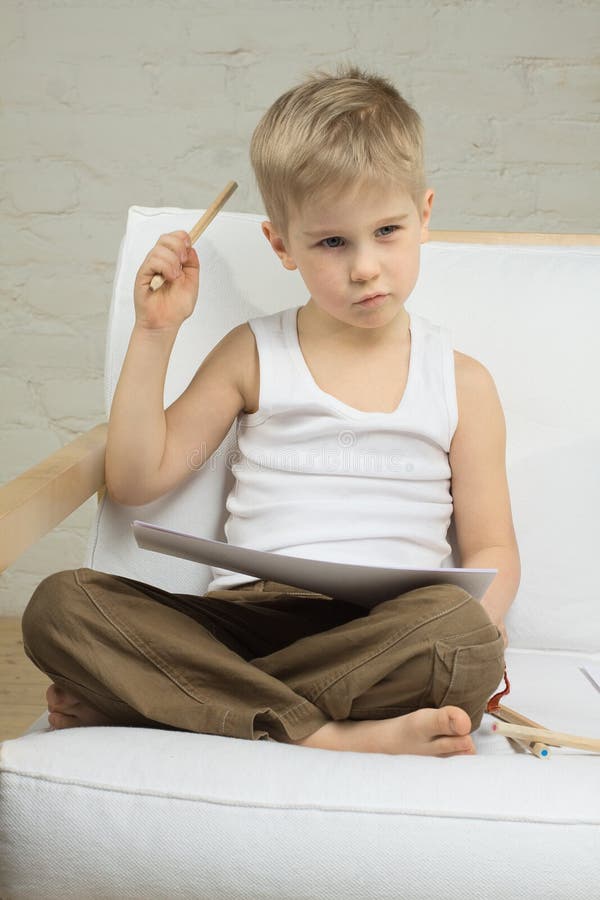 Education - child boy thinking stock photo
