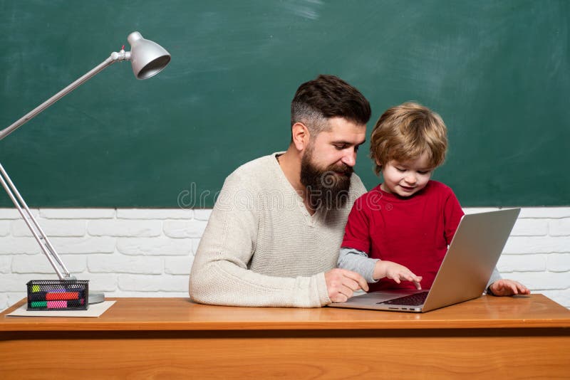 Education and learning people concept - little student boy and Teacher. Young adult concept. Happy family. Parent