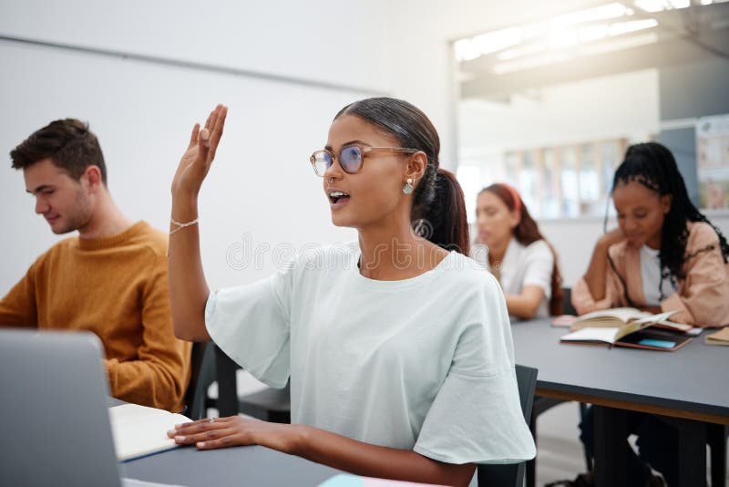 College Students Asking Questions In The Classroom