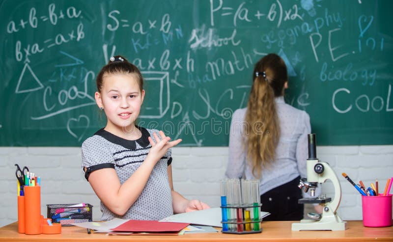 Educational experiment. Formal education school. Back to school. School classes. Girls study chemistry in school royalty free stock photo
