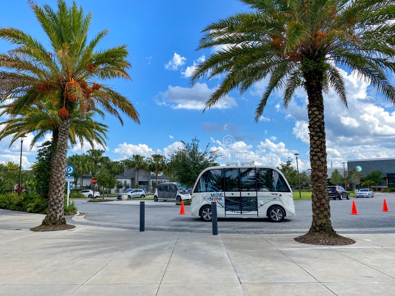 Orlando, FL/USA-6/20/20: An autonomous vehicle called Beep at a shuttle stop in the Laureate Park subdivision of Lake Nona in Orlando, Florida. Orlando, FL/USA-6/20/20: An autonomous vehicle called Beep at a shuttle stop in the Laureate Park subdivision of Lake Nona in Orlando, Florida