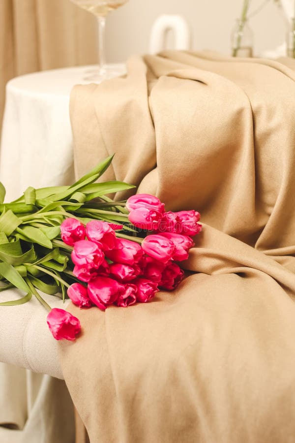A bouquet of pink flowers sewn on beige stylish linen. A bouquet of pink flowers sewn on beige stylish linen.