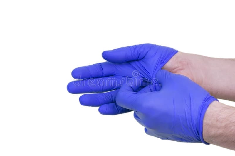 Een foto van mens arts het zetten op beschermende die handschoenen, op wit wordt geïsoleerd royalty-vrije stock afbeeldingen Een foto van mens arts het zetten op beschermende die handschoenen, op wit wordt geïsoleerd royalty-vrije stock afbeeldingen