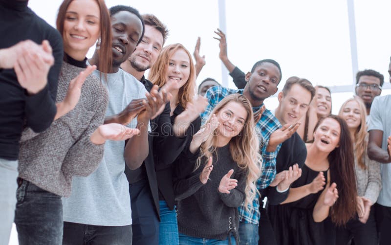 Group of diverse young people are applauding while looking at you. photo with a copy-space. Group of diverse young people are applauding while looking at you. photo with a copy-space