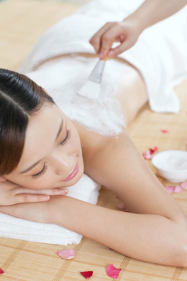 A young lady enjoy body mask in spa salon, indoors. Photo taken on: June 28th, 2013. A young lady enjoy body mask in spa salon, indoors. Photo taken on: June 28th, 2013