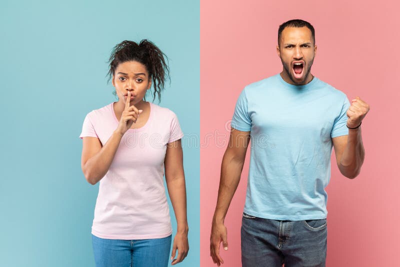 Young black woman gesturing hush sign, holding finger near mouth, man screaming and clenching fist at camera isolated over blue and pink studio background wall. Young black woman gesturing hush sign, holding finger near mouth, man screaming and clenching fist at camera isolated over blue and pink studio background wall