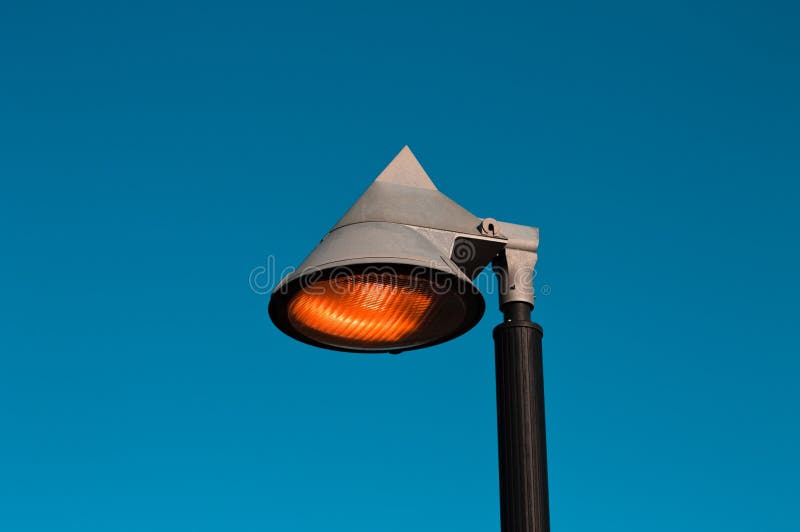 A lamppost light with a blue background Pesaro, Italy, Europe. A lamppost light with a blue background Pesaro, Italy, Europe