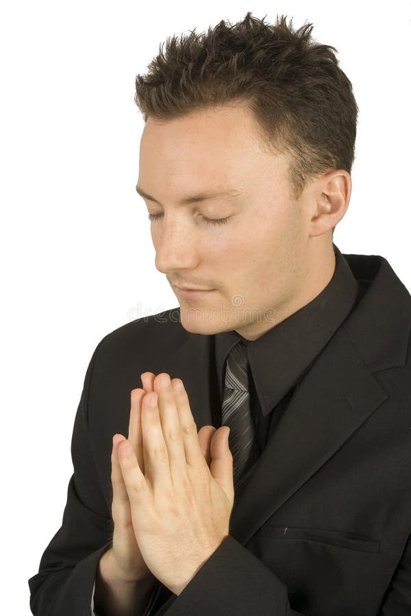 A businessman praying for something. A businessman praying for something