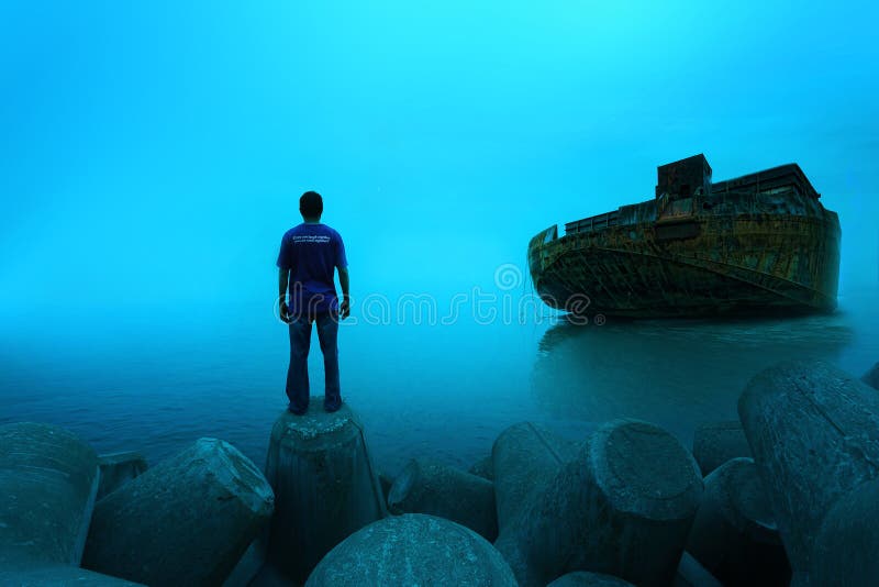 Een mens die zich met aakschip… bevinden stock afbeelding Een mens die zich met aakschip… bevinden stock afbeelding