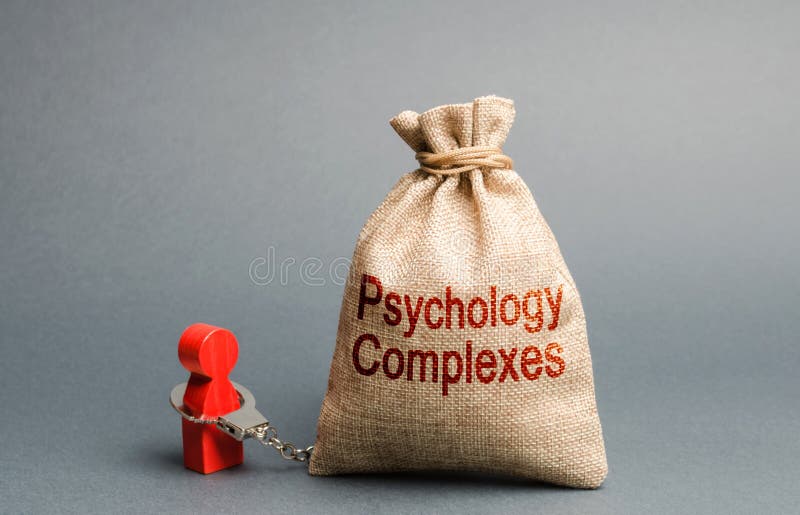 Een persoon de handboeien om:doen met een zak ge?tiketteerd psychologische complexen Gevoel van minderwaardigheid en laag zelfres stock afbeeldingen Een persoon de handboeien om:doen met een zak ge?tiketteerd psychologische complexen Gevoel van minderwaardigheid en laag zelfres stock afbeeldingen