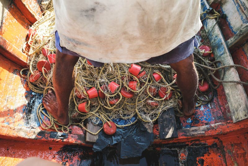 Een visser met hun net in Cabo DE La vela stock afbeelding Een visser met hun net in Cabo DE La vela stock afbeelding