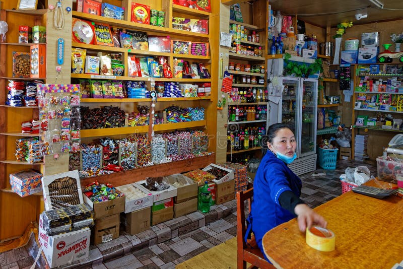 RENCHINLKHUMBE, MONGOLIA, Marc 3, 2020 : A woman with a mask in a grocery at the beginning of Covid-19 pandemic disease. RENCHINLKHUMBE, MONGOLIA, Marc 3, 2020 : A woman with a mask in a grocery at the beginning of Covid-19 pandemic disease