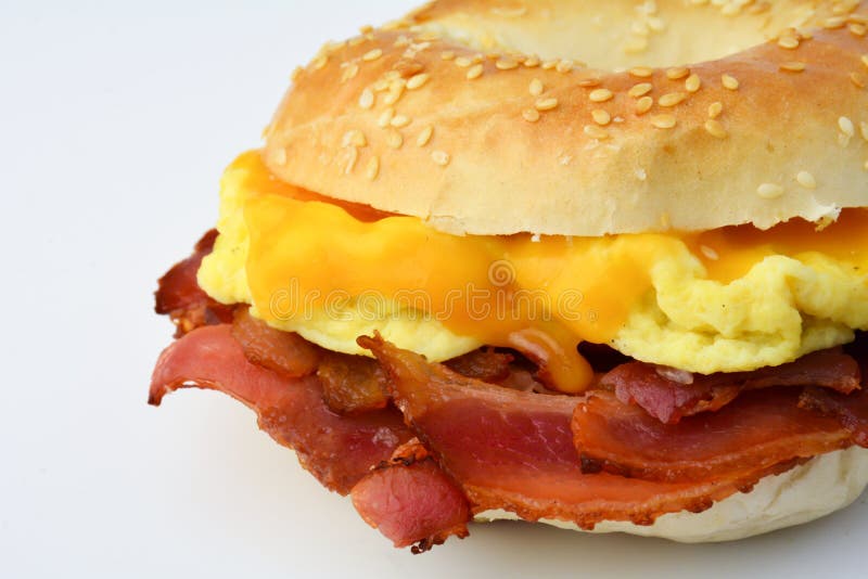 Bagel with Fried Bacon, Scrumbled Eggs and Cheddar Cheese Stock Photo