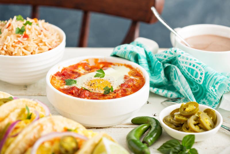 Egg baked in tomato sauce stock image. Image of mexican 67617127