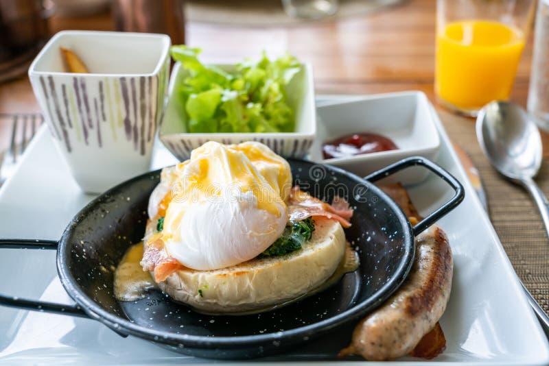 Egg Benedict with Bacon and Sausage Stock Photo Image of tasty