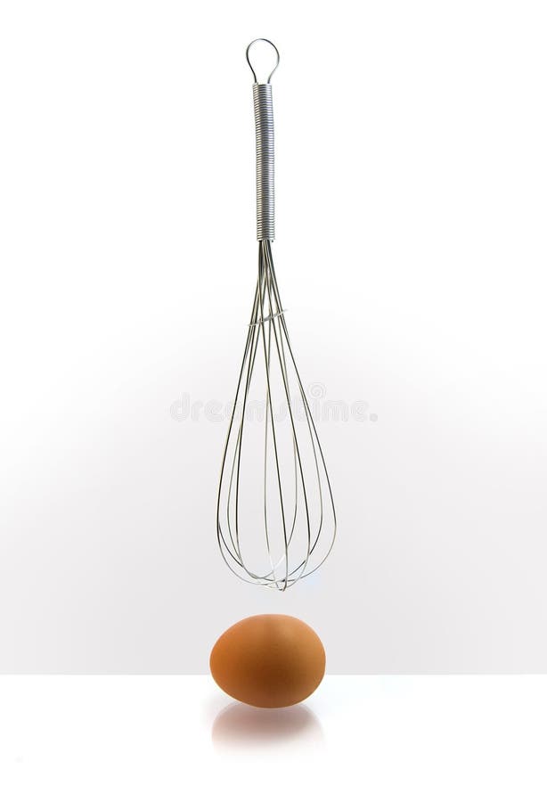 Egg in front of kitchen whisk