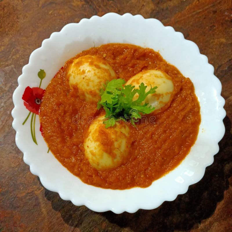 Indian Main Course Recipe of Boiled Eggs with Tomato Gravy Stock Photo