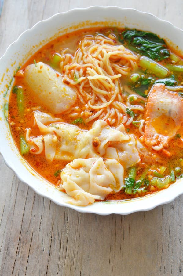 Egg Noodle with Pork Dumpling in Spicy Soup on Bowl Stock Photo Image