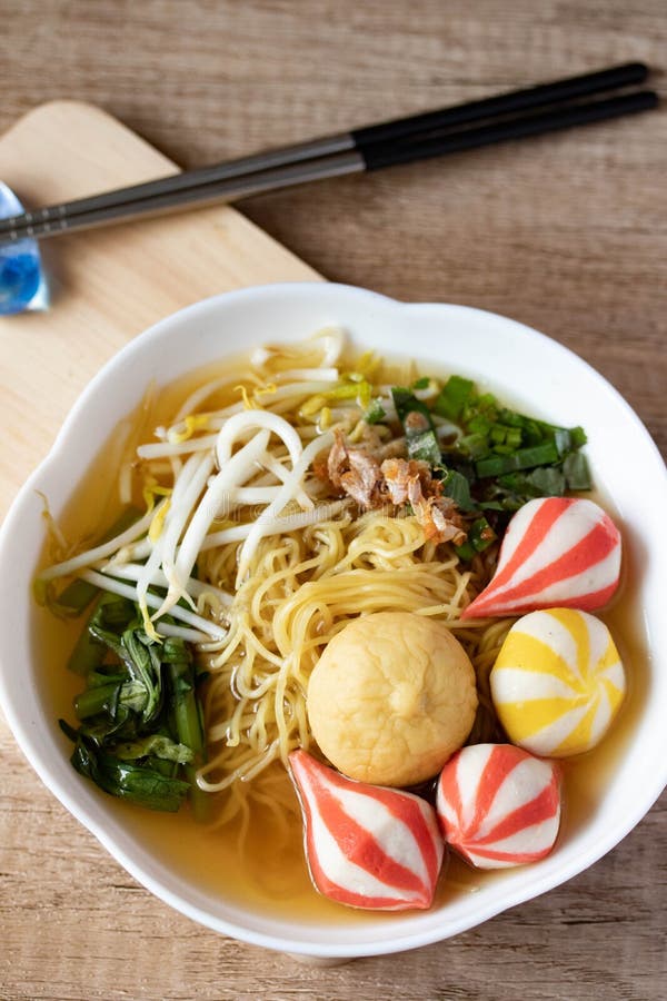 Egg Noodles with Japanese Colorful Fish Balls in a White Cup Stock