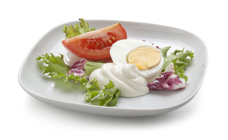 Egg and tomato with salad