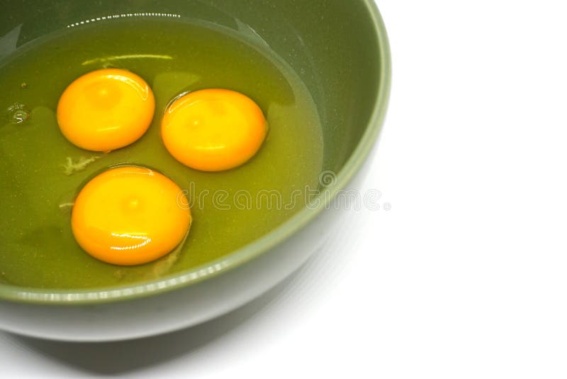 Egg yolk in green bowl stock photo. Image of cholesterol 87657504