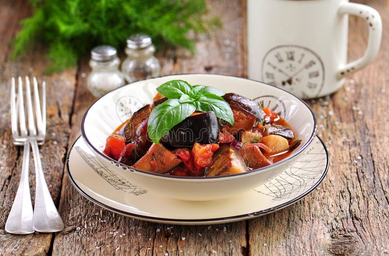 Eggplant Stewed with Red Onion, Tomato and Dill. Rustic Style Stock