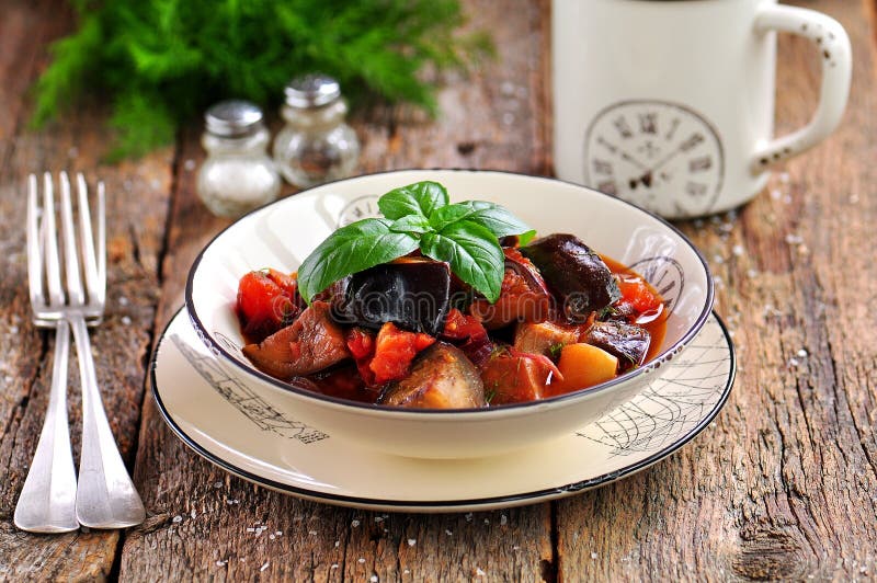 Eggplant Stewed with Red Onion, Tomato and Dill. Rustic Style Stock