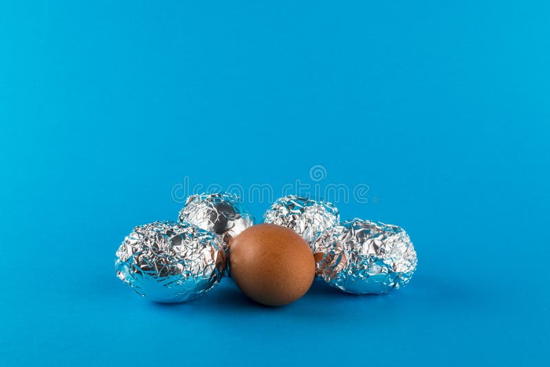 Eggs in aluminum foil stock image. Image of foil, card 214916759
