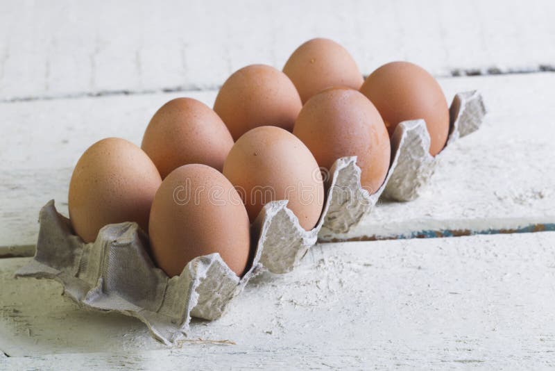 Eggs in a Cardboard Tray on a White Boards. Stock Image Image of