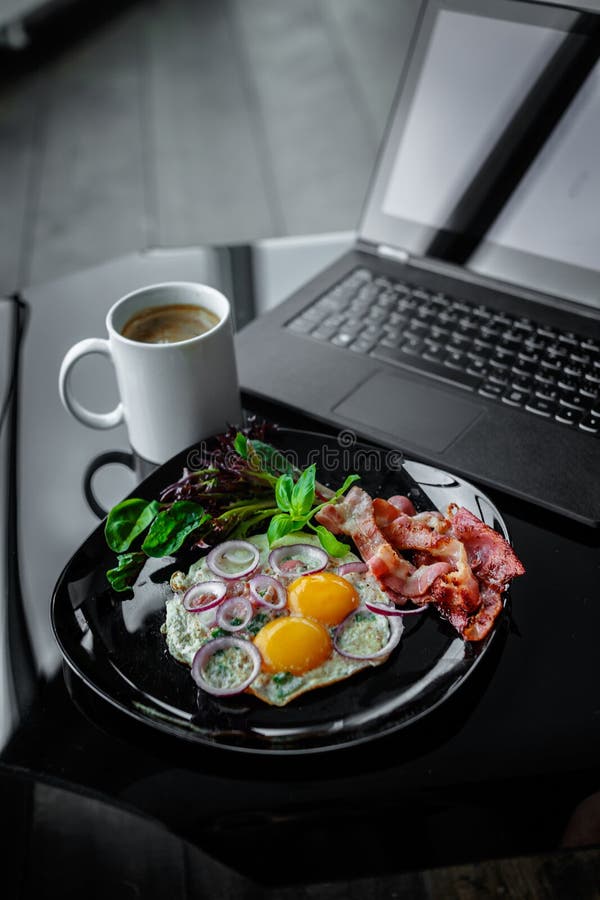 Eggs, coffee near laptop. stock photo. Image of device 106770258
